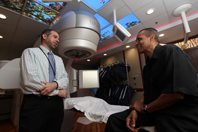 Clarence Massey talks with Dr. David Schreiber, who cared for him during his bout with prostate cancer and continues to provide follow-ups. (Photo by Mitch Mirkin)