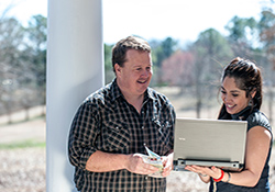 VA social worker Amy Mitchell, seen here with James Love, helps conduct outreach as part of the Alabama Veterans Rural Health Initiative. A
    Tuscaloosa-based research study found the project helped speed enrollment in VA care for rural Veterans.