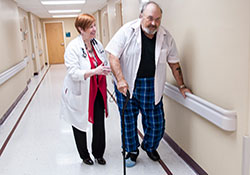 Veteran George Murphy of Pinson, Ala., is guided by Dr. Cynthia J. Brown as he participates in a fall-prevention clinic at theBirmingham VA Medical Center.