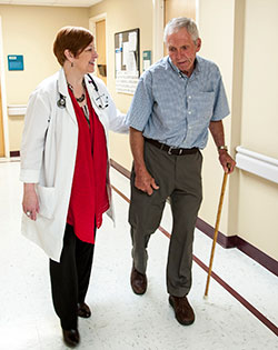  Veteran Kenneth Hanners of Decatur, Ala., is guided by Dr. Cynthia J. Brown as he participates in a fall-prevention clinic at the Birmingham VA Medical Center.