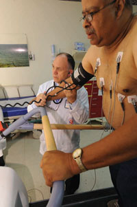 Dr. Peter Kokkinos oversees a cardiac stress test for Albert McMillan, 63, at the Washington, DC, VA Medical Center. Patients walk or run on the machine as the speed and elevation increase, until they feel fatigued. Researchers use the results to calculate fitness levels.