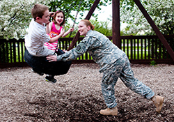 Illinois Army National Guard Sgt. 1st Class Sarah J. Campbell enjoys quality time with her children.  