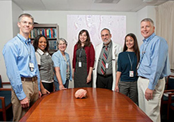 The Boston group that staffs the VA Biorepository Brain Bank and related Gulf War Veterans' Illnesses Biorepository includes (from left): neuropathologist Dr. Thor Stein; project coordinator Latease Guilderson; data manager Sally Perkins; project support assistant Melissa Weiner; principal investigator Dr. Neil Kowall; project coordinator Shelley Amberg; and director of scientific operations Dr. Christopher 'Kit' Brady.