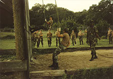 Cresci (seen coming down the wall) takes part in an Army training course at Fort Sam Houston in 1991. 

