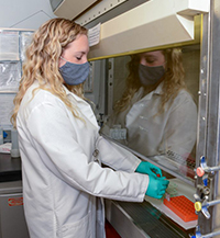 A team member at the Atlanta VAMC biorepository site processes a specimen. (Photo by Adam Hernandez)