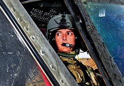      U.S. Army Chief Warrant Officer 2 Bethany Bump conducts her preflight routine in a UH-60 Black Hawk helicopter before a mission in Afghanistan's Nangarhar
    province in spring 2013. (U.S. Army photo by Sgt. 1st Class John D. Brown)	