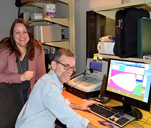 Research coordinator Stephanie Edmunds and audiologist Dan McDermott at the VA Portland Healthcare System in Oregon work with audiometry equipment.  (Photo by Cody Goheen, VA Portland Healthcare System.)